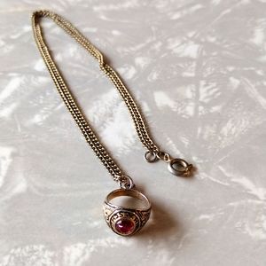 High school miniature class ring necklace.